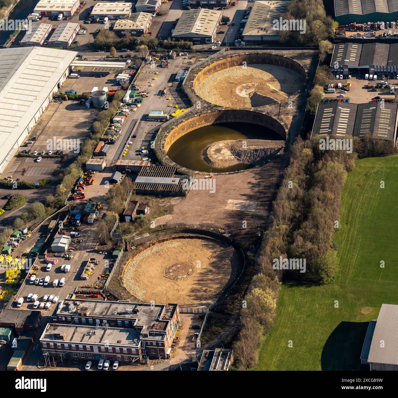 Aerial photo showing 3 demolished gasometers with bases being filled in Stock Photo