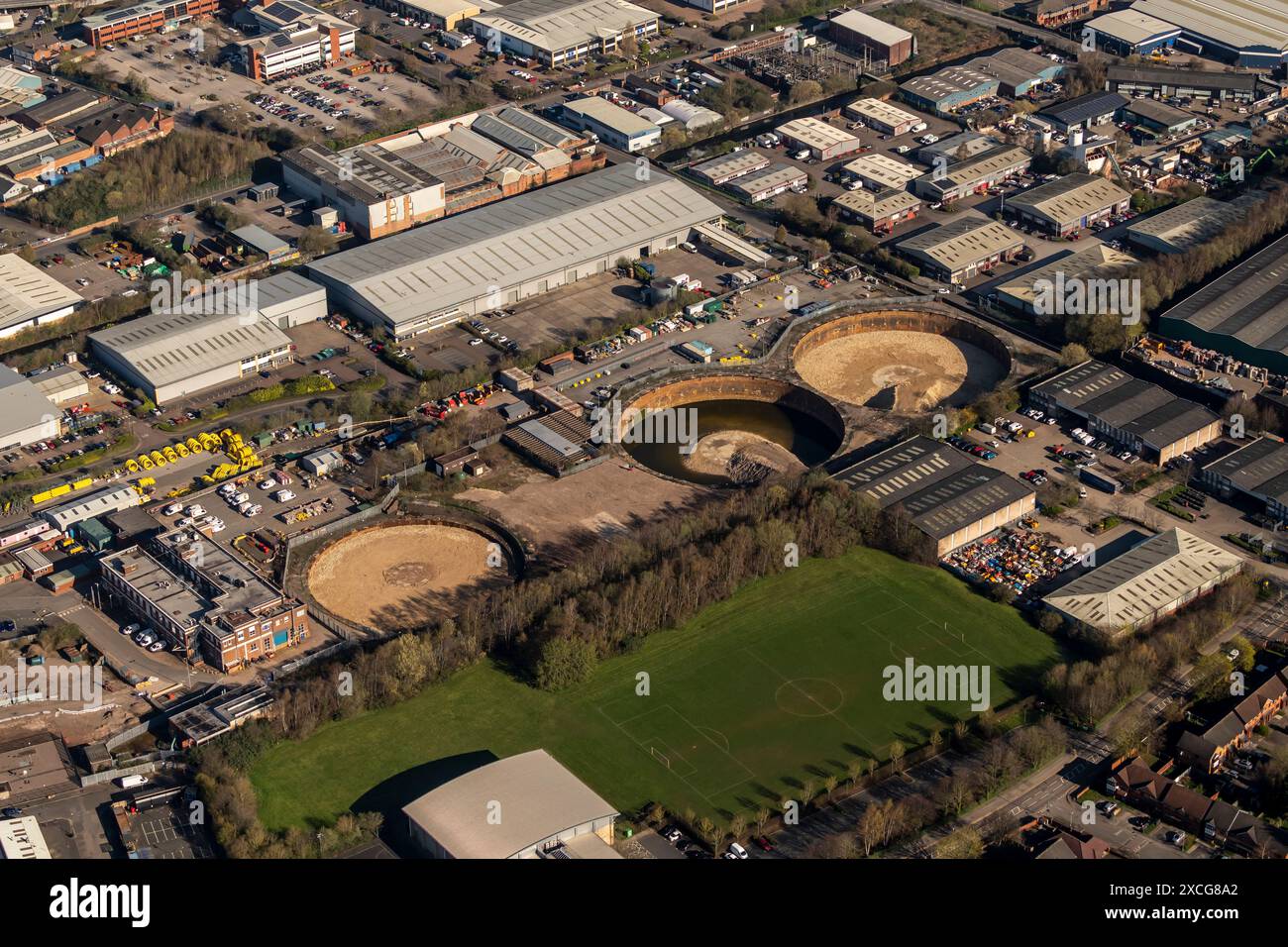 Aerial photo showing 3 demolished gasometers with bases being filled in Stock Photo