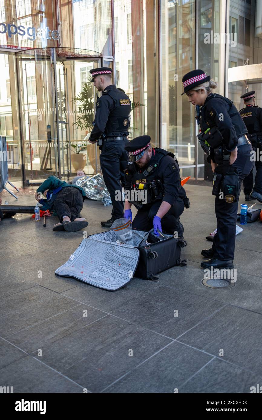 City Of London, UK, 17th June 2024. Members of Palestinian Action spray red paint and chain themselves to the front and rear of 201 Bishopsgate. The  building is the UK head office to Scotiabank an investor in Elbit who supply 85% of drones to the IDF. Credit: James Willoughby/Alamy Live News Stock Photo