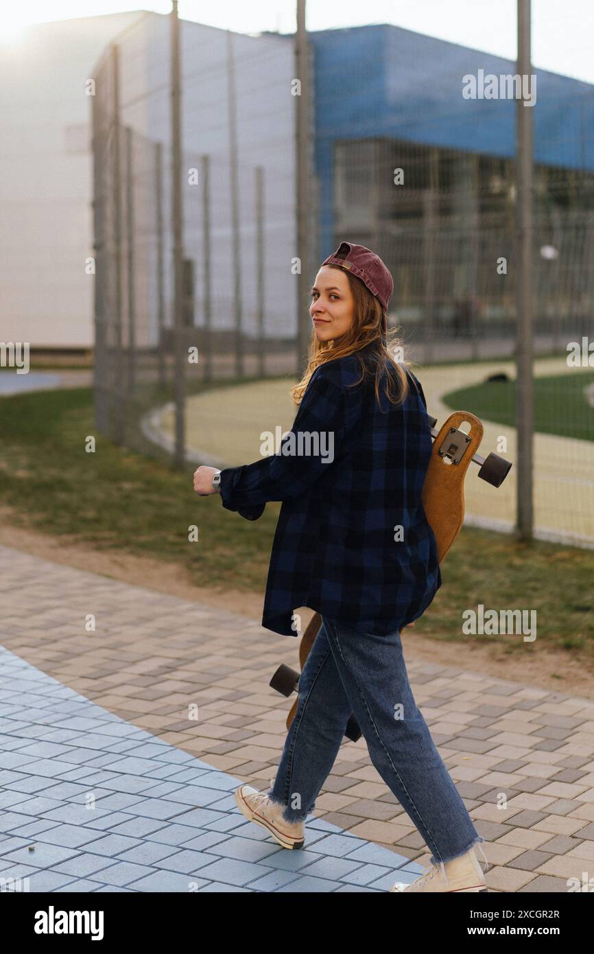 Old woman walks along road hi-res stock photography and images - Alamy