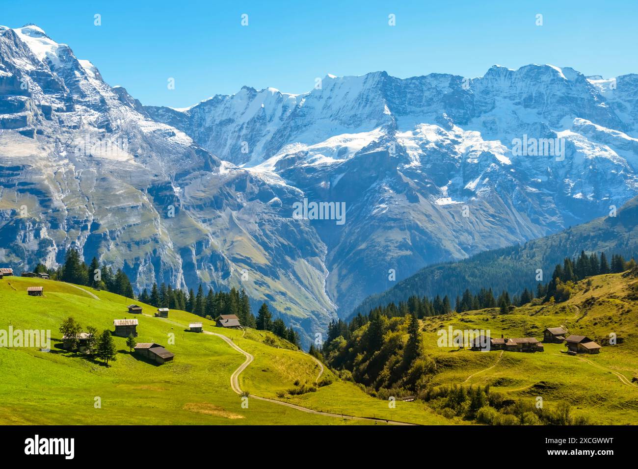 Traditional alpine village in touristic valley Lauterbrunnen ...