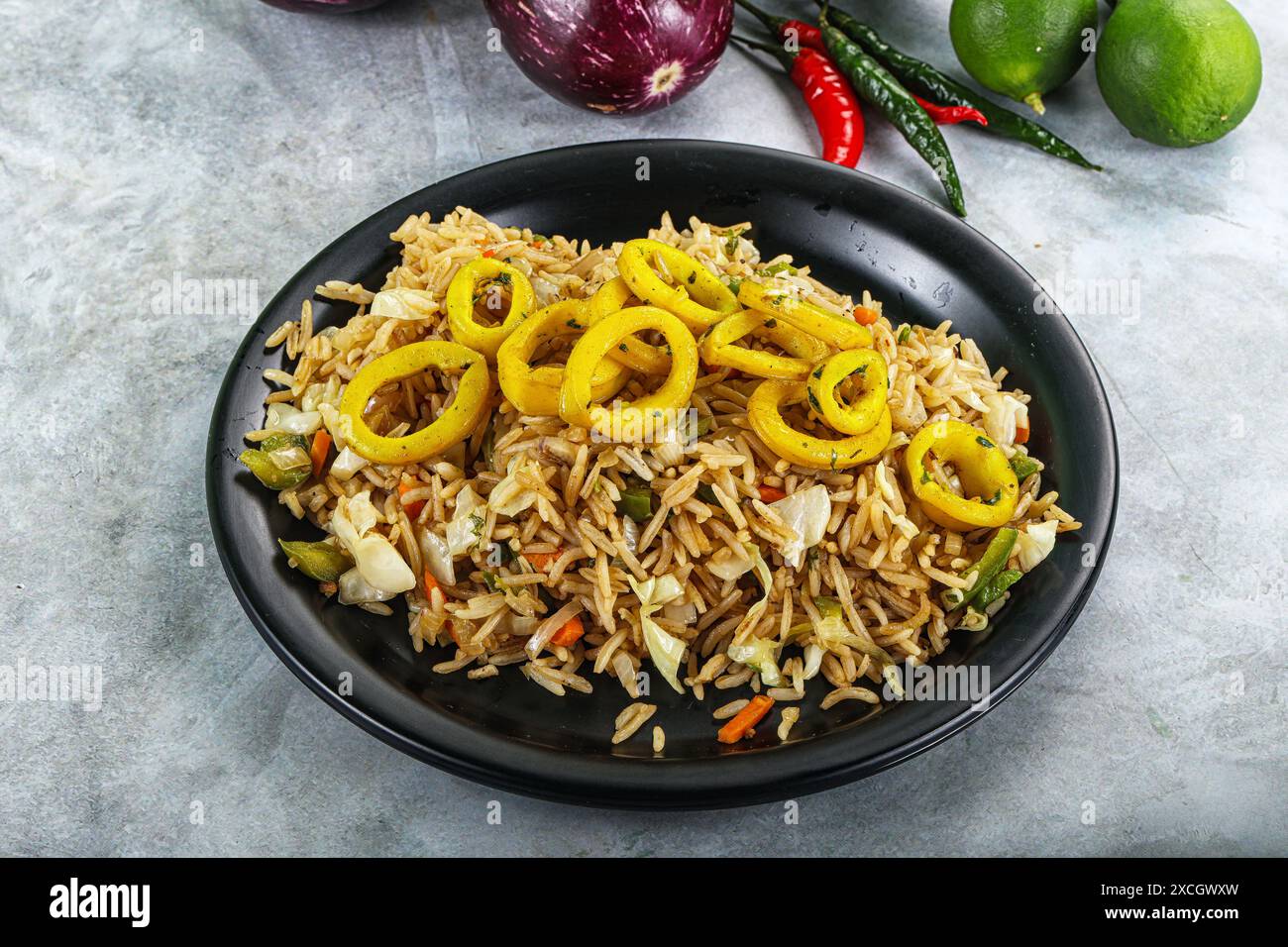 Asian cuisine - Fried rice with squid rings Stock Photo - Alamy