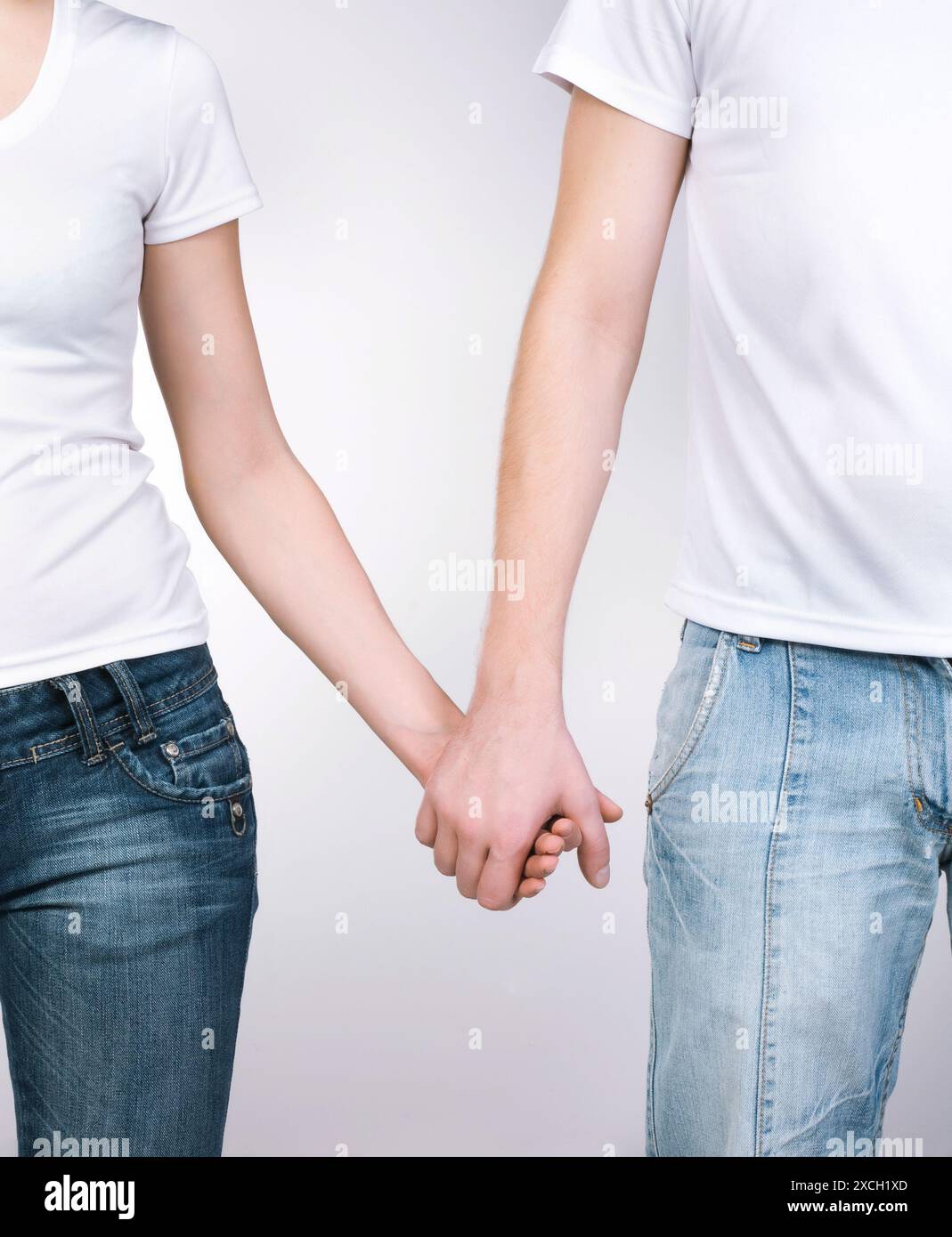 boy and girl holding hands Stock Photo - Alamy