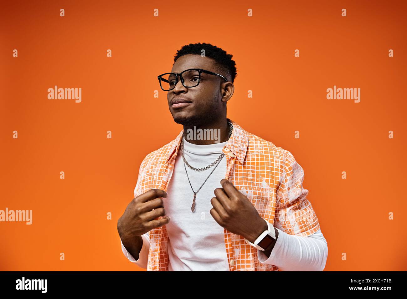 Young man in formal attire poses confidently hi-res stock photography ...