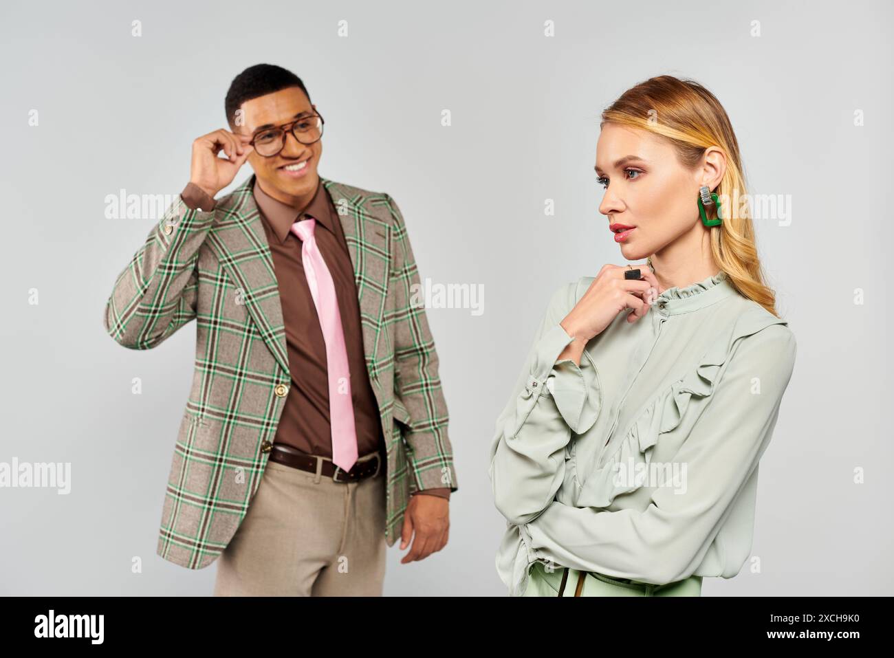 A man and woman stand together in an affectionate pose Stock Photo - Alamy