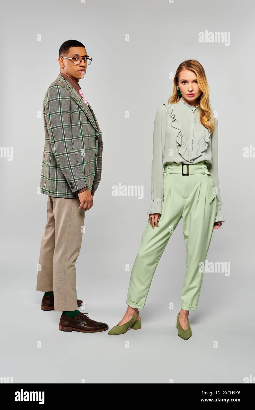 A man and woman elegantly posing together for a photo Stock Photo - Alamy