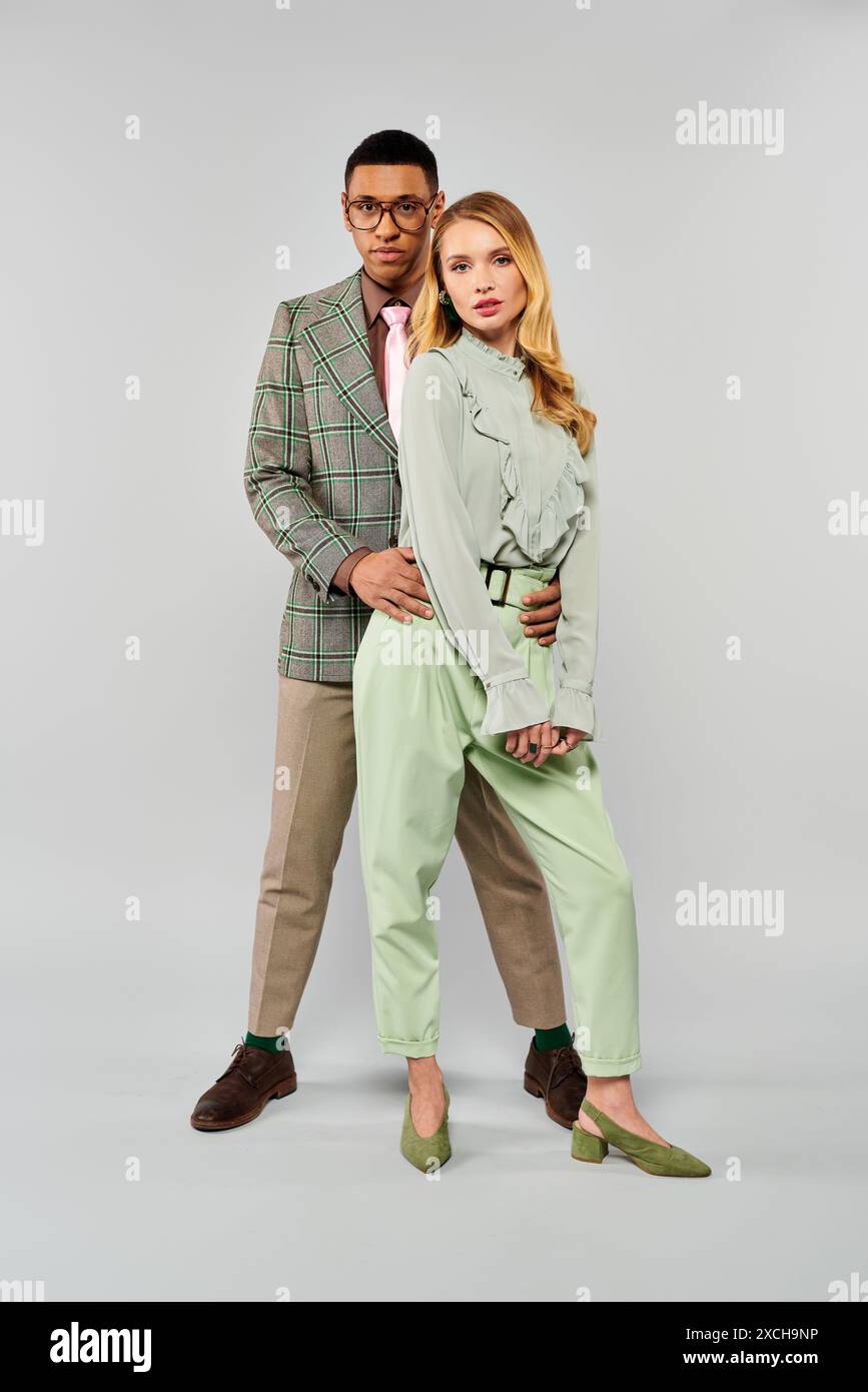 A man and woman striking a pose together Stock Photo - Alamy