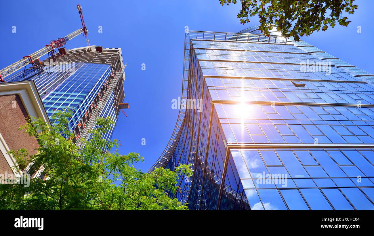 High rise building under construction. Installation of glass facade ...