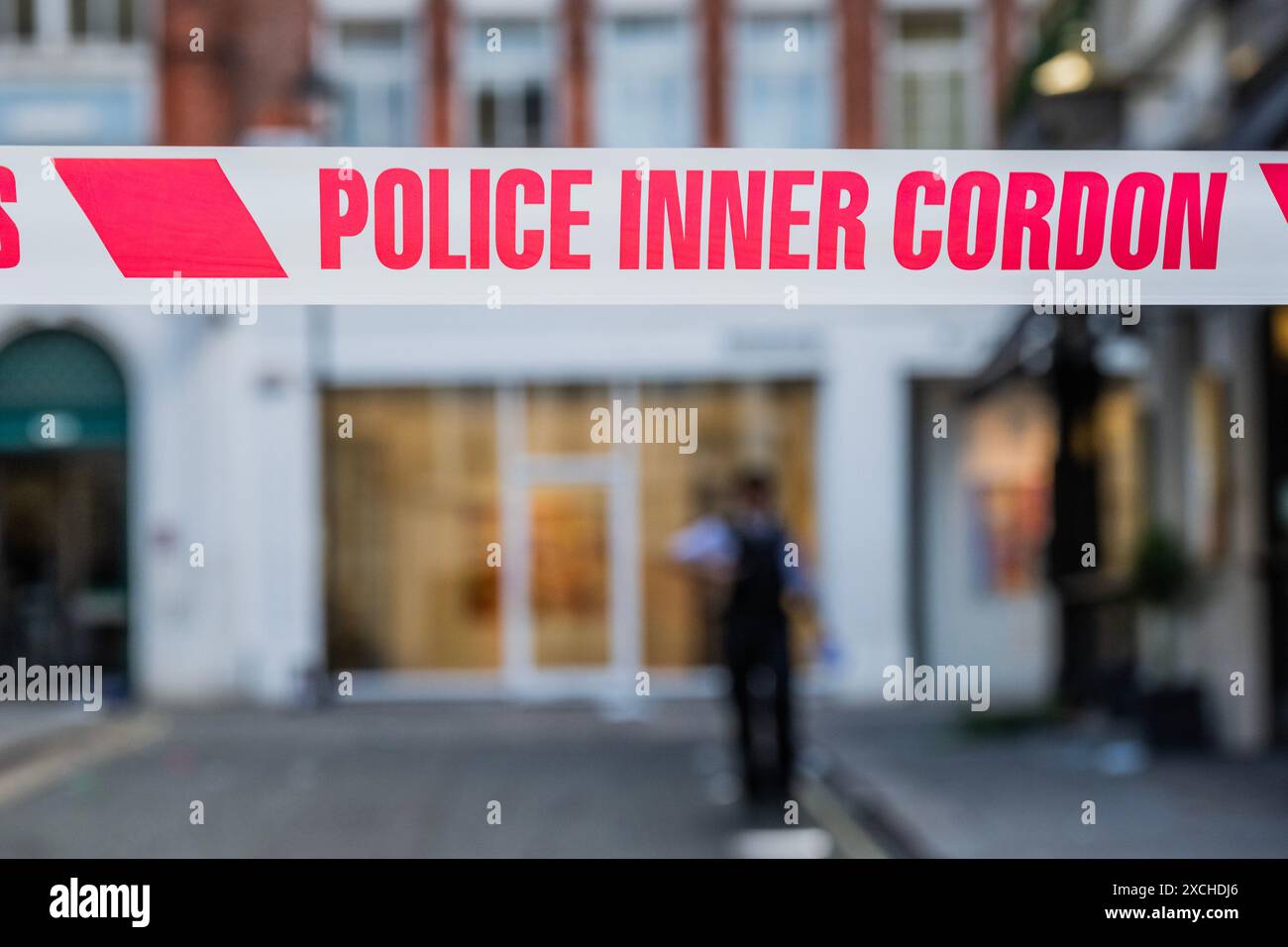 London, UK. 17th June, 2024. Police cordon off Dering Street, which is
