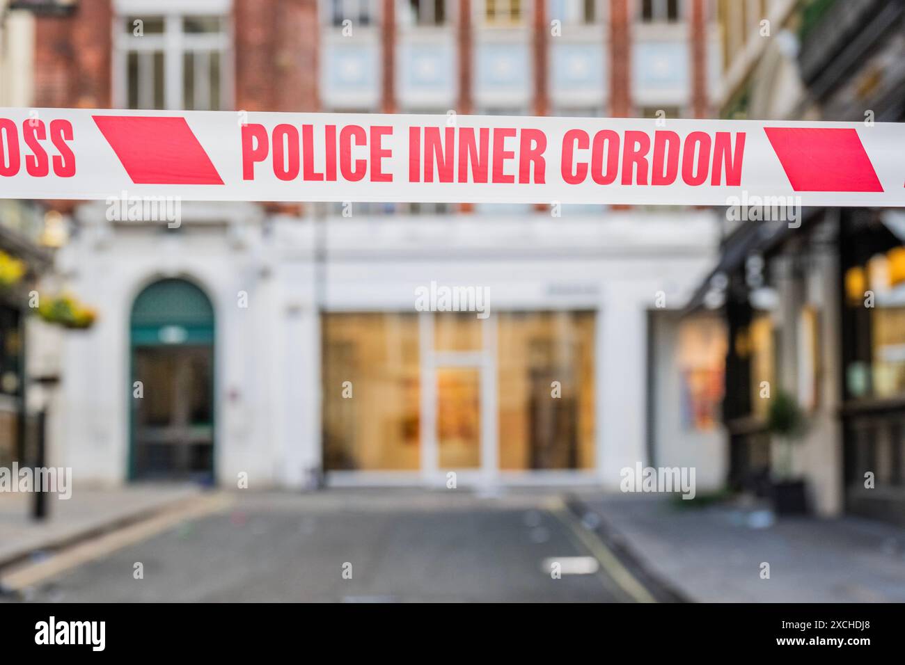 London, UK. 17th June, 2024. Police cordon off Dering Street, which is