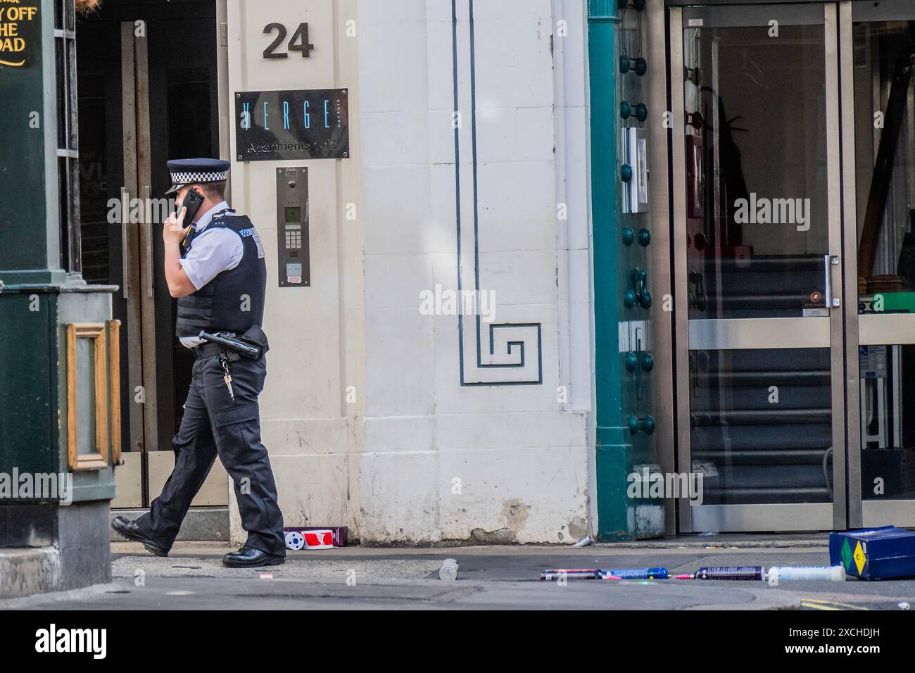 London, UK. 17th June, 2024. Police cordon off Dering Street, which is