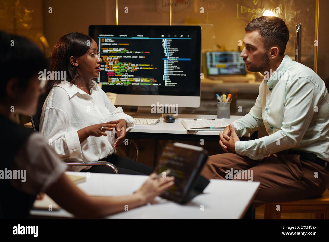 Team of software developers working on big project Stock Photo