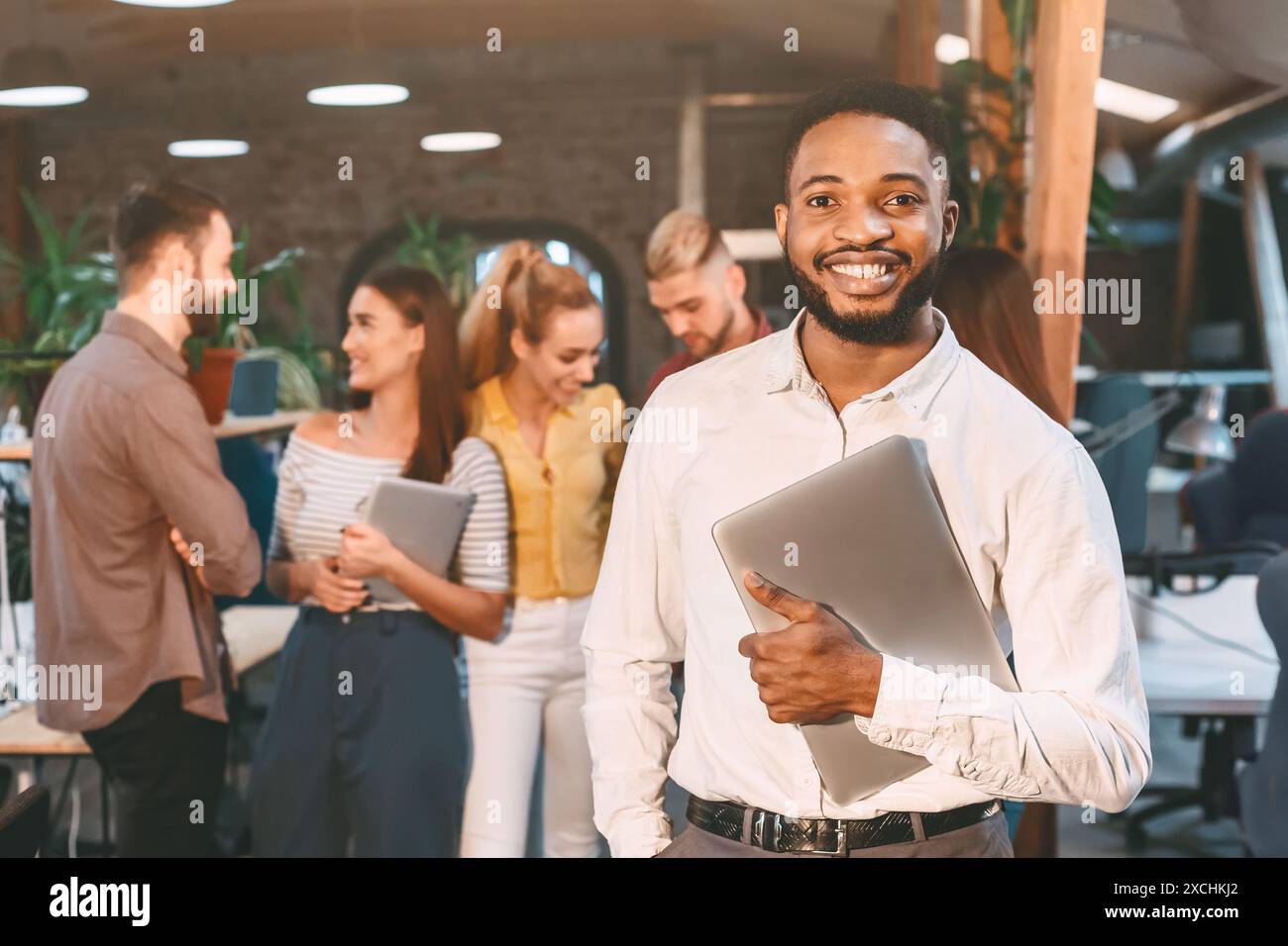 Smiling happy multicultural office hi-res stock photography and images ...