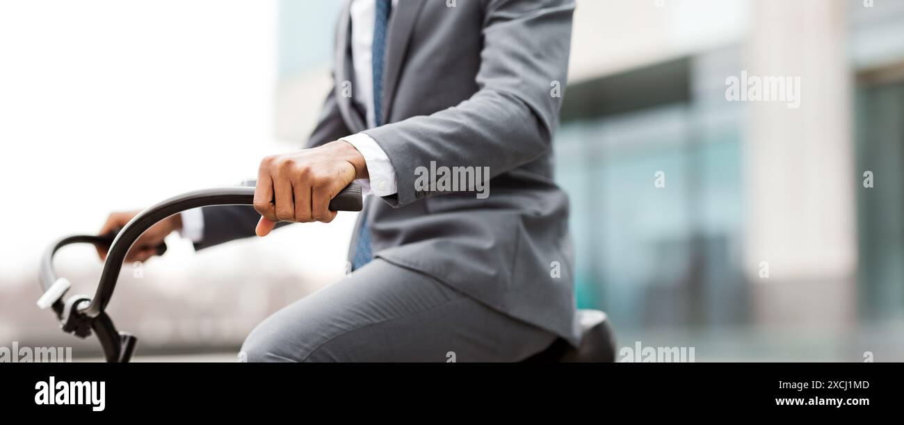 Professional commuting by bike in modern city, cropped Stock Photo - Alamy