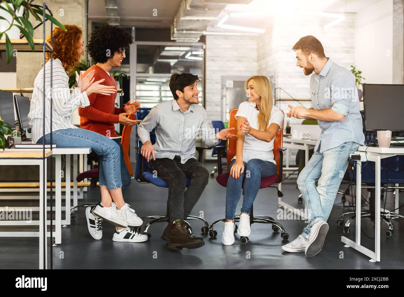 Diverse Professionals Employees Strategizing at Open-Plan Workspace Stock Photo