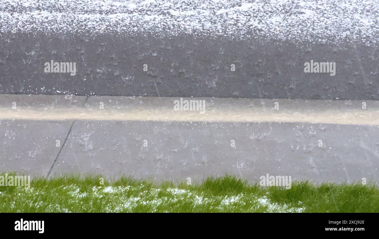 Lawn and Rock Garden Covered in Hail After Storm Stock Photo - Alamy