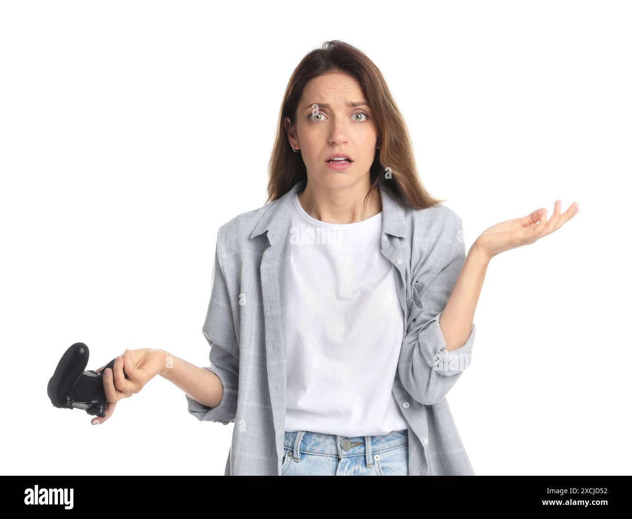 Confused woman with game controller on white background Stock Photo - Alamy