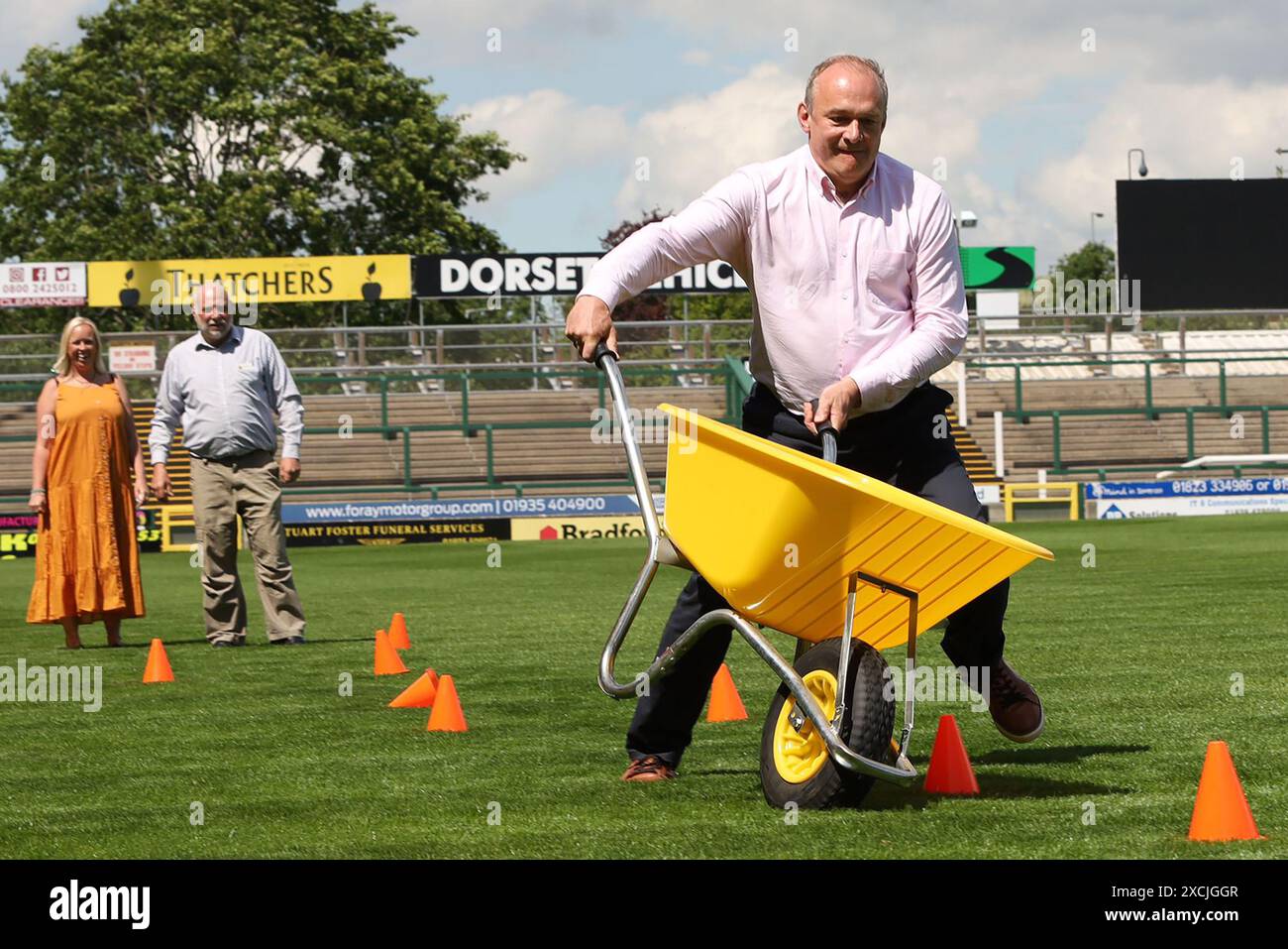 Wheelbarrow Racing Liberal Democrats leader Sir Ed Davey taking part in wheelbarrow racing ...