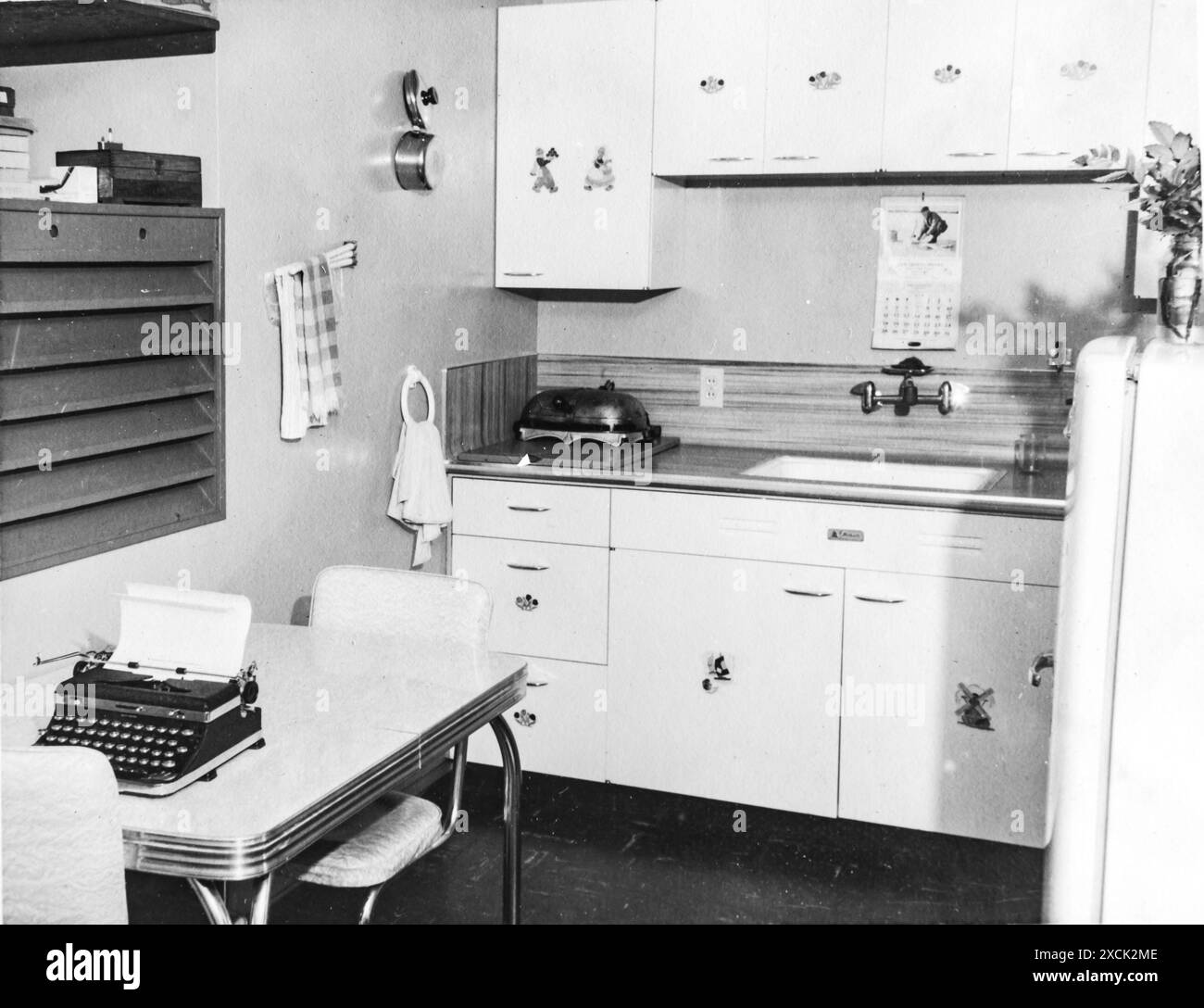 House interior with kitchen ,fridge, sink and kitchen table with a