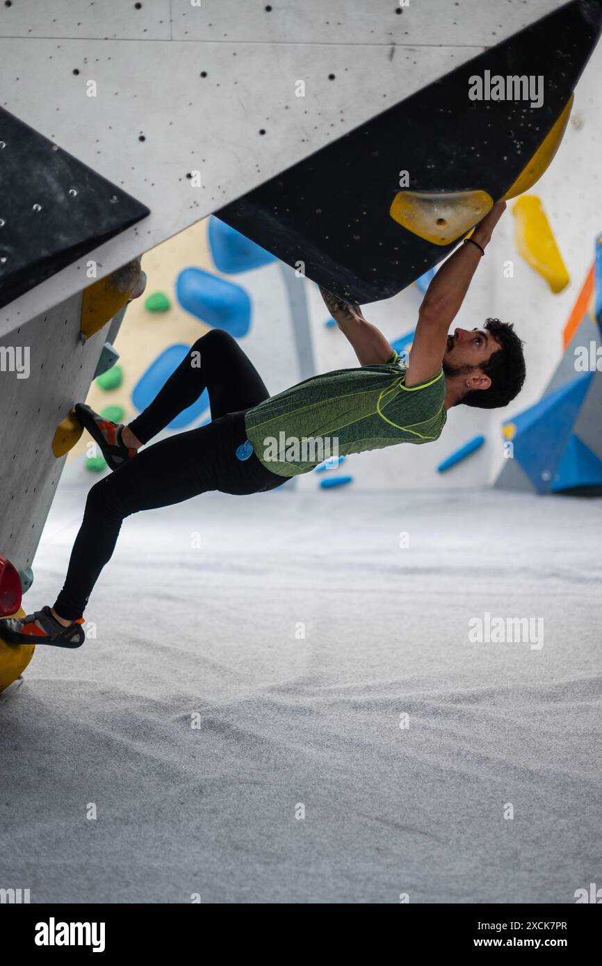 Young man climbing on rock hi-res stock photography and images - Alamy