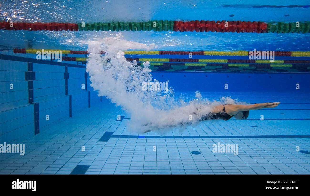 Water entry, immersion of three professional swimmers during swimming ...