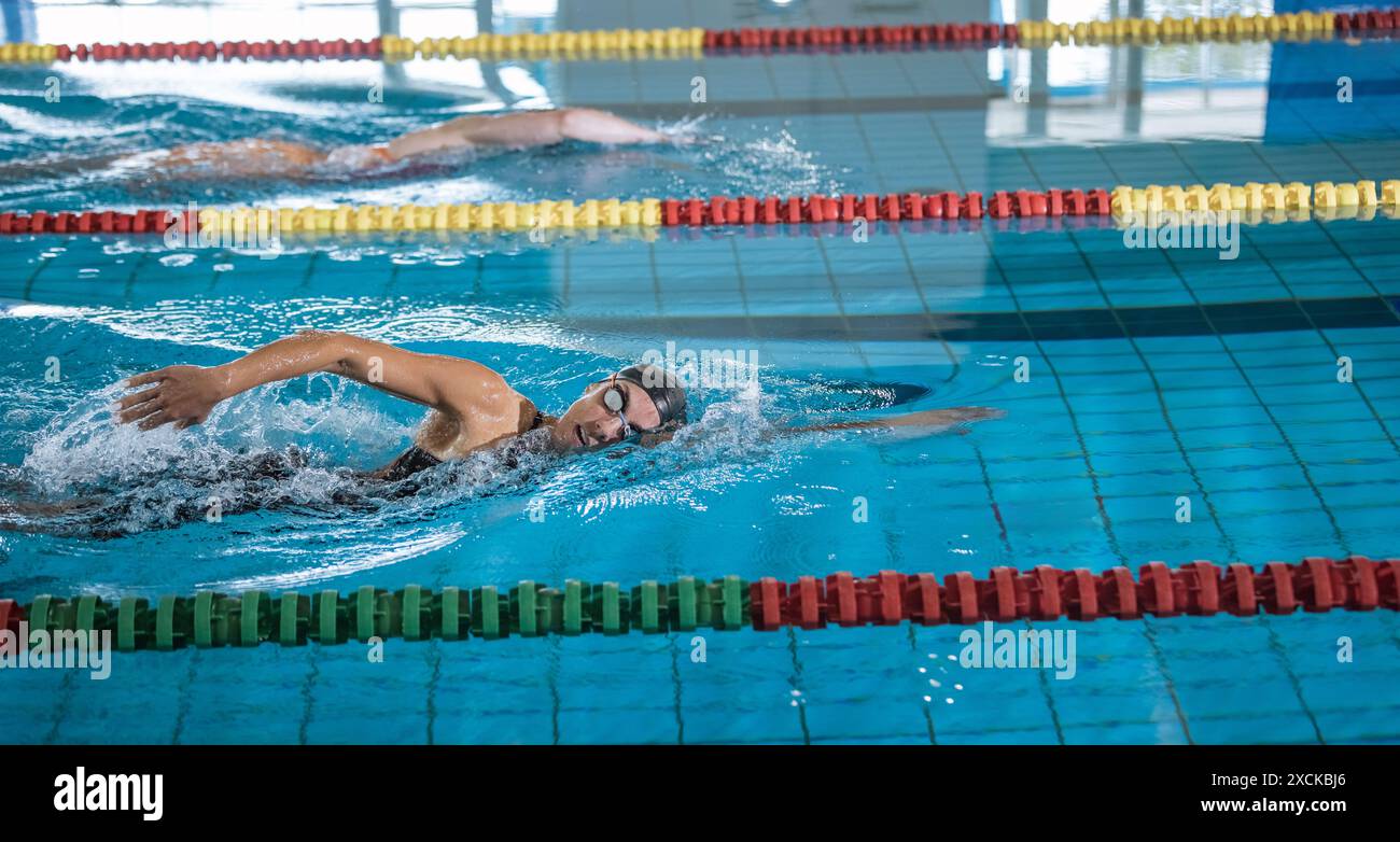 Two female swimmers during a race in the freestyle swim discipline ...