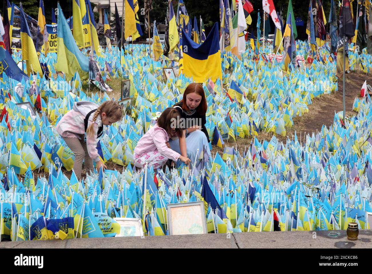 Non Exclusive: KYIV, UKRAINE - JUNE 17, 2024 - A woman and children ...