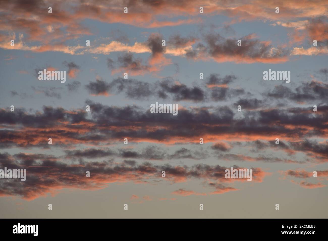 Orange, gray, white, black dramatic clouds. Stock Photo
