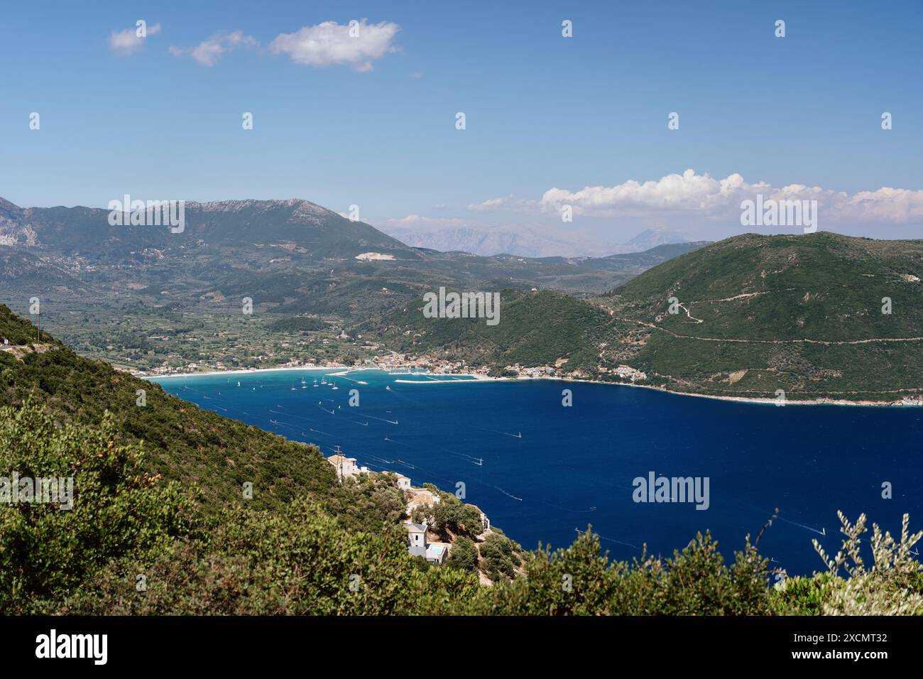 Scenic coastal landscape with clear blue sea and green hills Stock ...