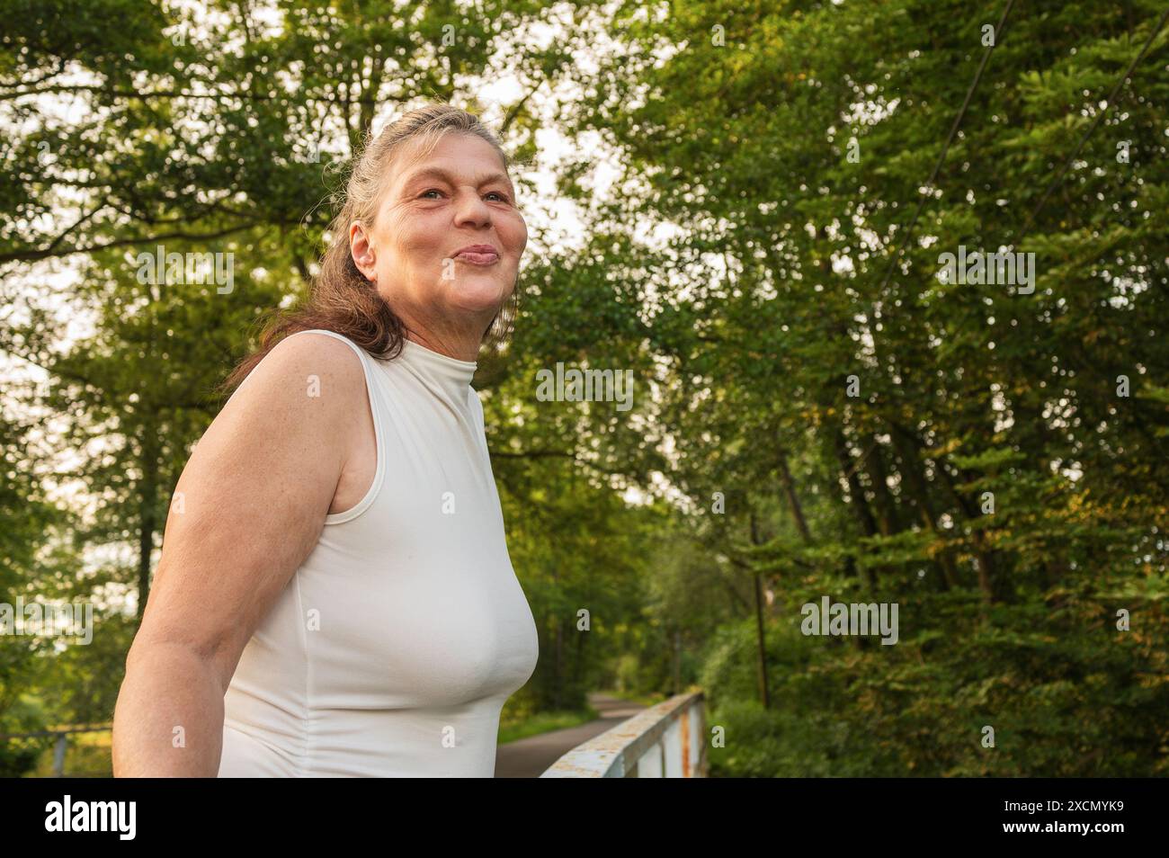 Smiling elderly woman on a walk Stock Photo