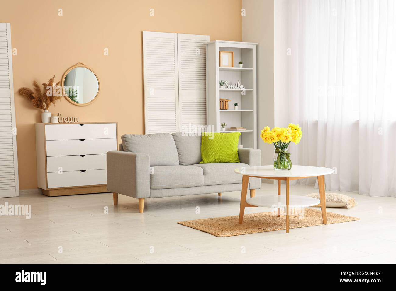 Daffodil flowers in interior of living room Stock Photo - Alamy