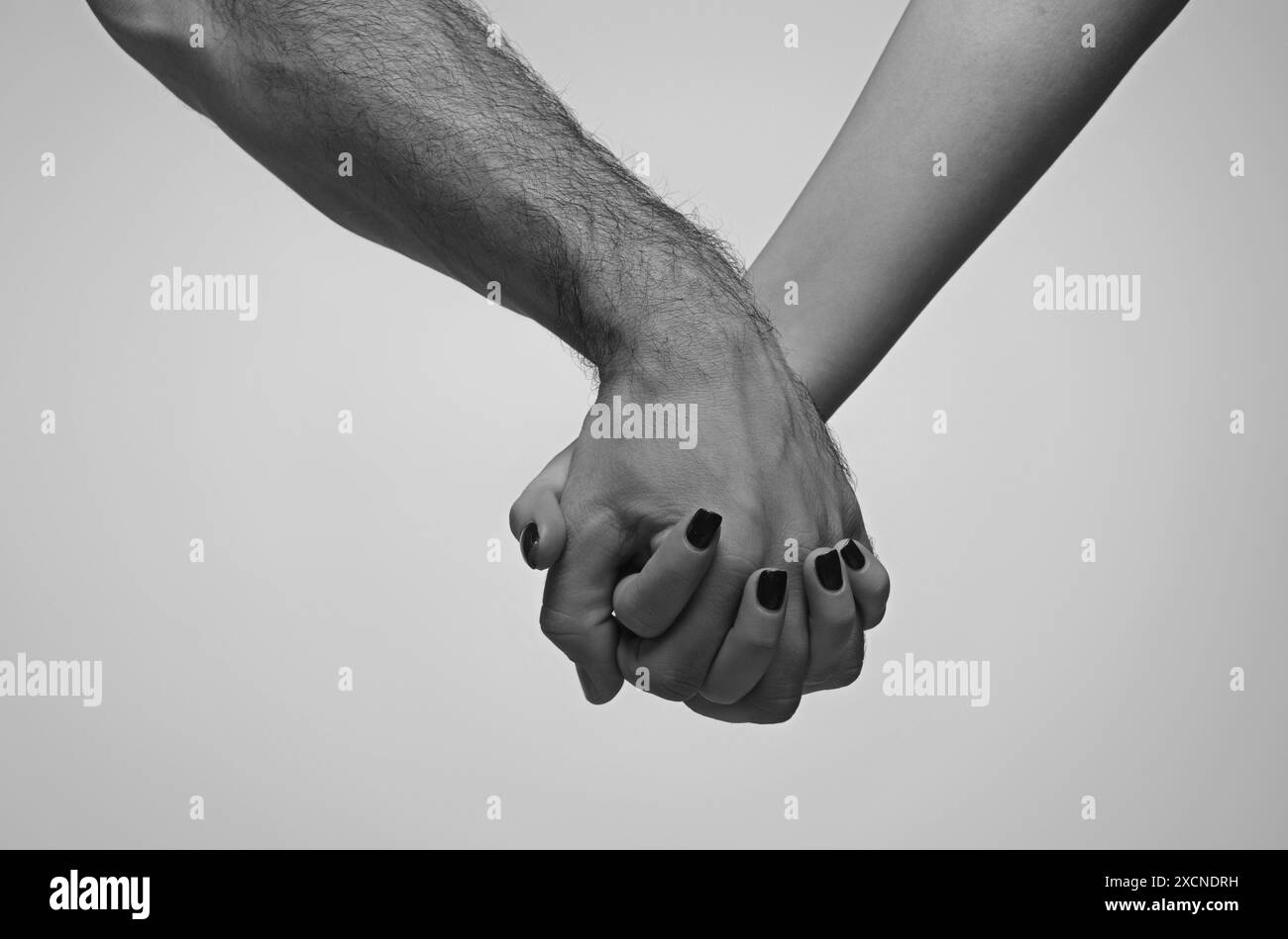 Helping hand. Holding hand, close up. Giving a helping hand. Rescue, helping gesture or hands. Salvation relations. Hand reaching out to help Stock Photo