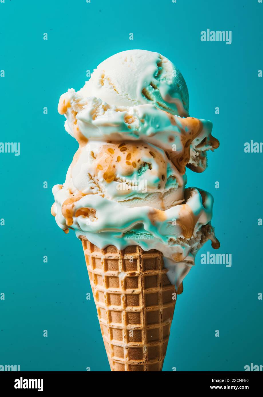 Two scoops of Vanilla ice cream on top ice cream cone blue background ...