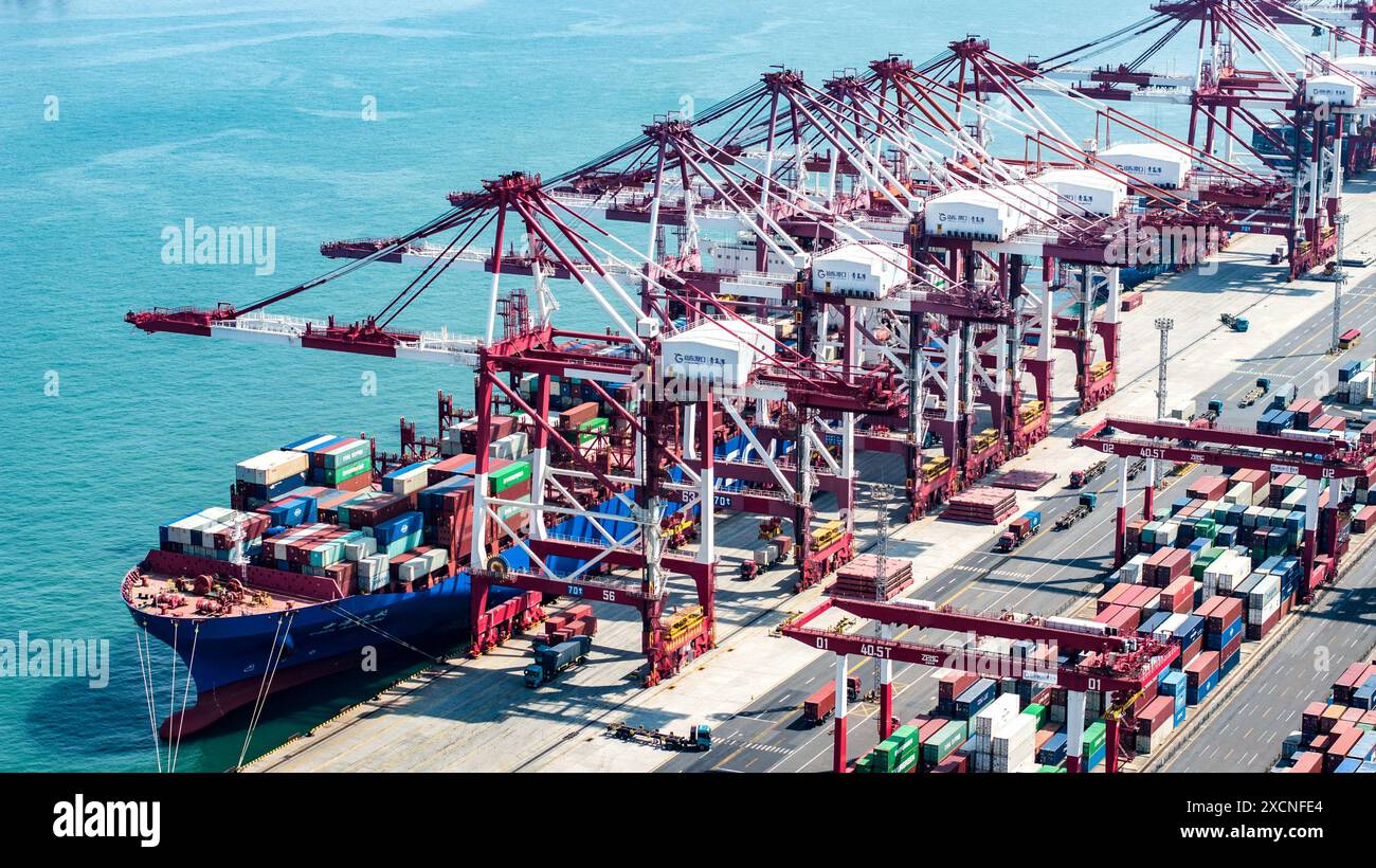 QINGDAO, CHINA - JUNE 18, 2024 - Container ships carry out container ...