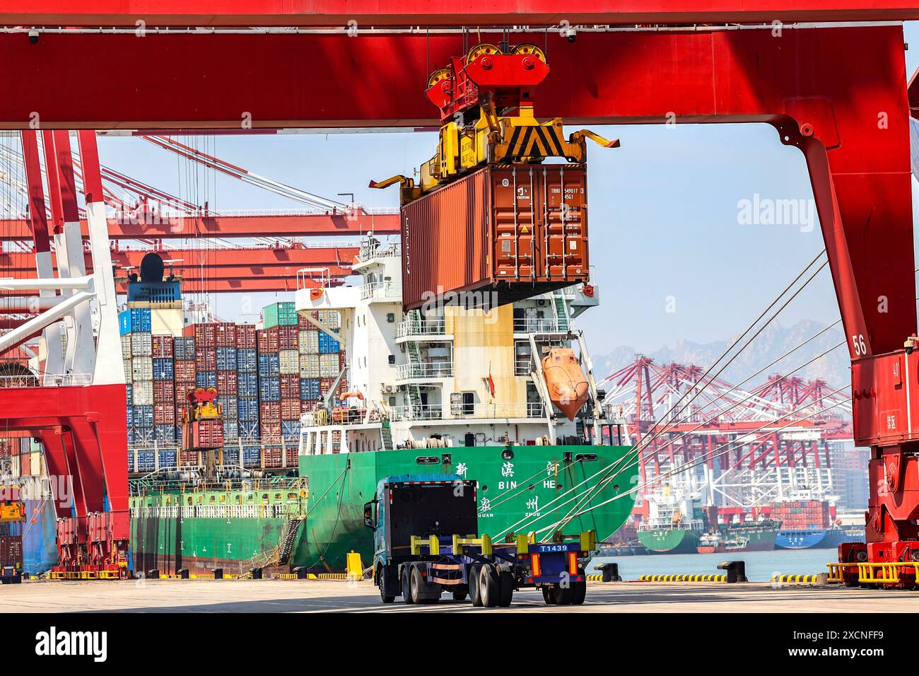 QINGDAO, CHINA - JUNE 18, 2024 - Container ships carry out container ...