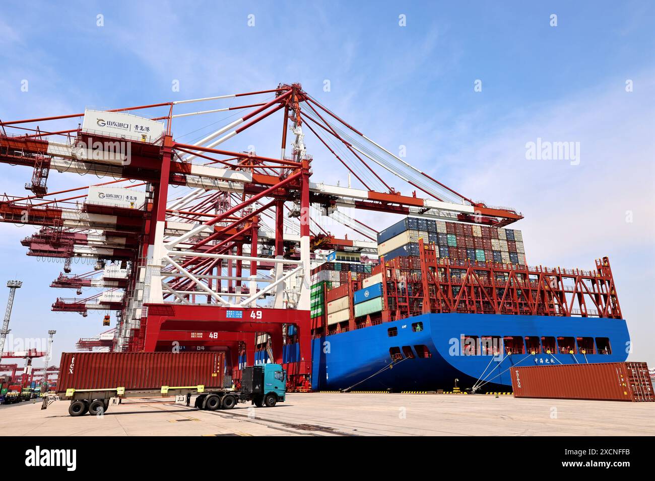QINGDAO, CHINA - JUNE 18, 2024 - Container ships carry out container ...