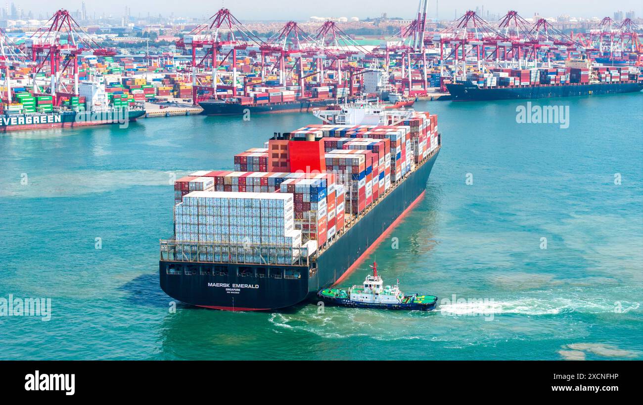 QINGDAO, CHINA - JUNE 18, 2024 - Container ships carry out container ...