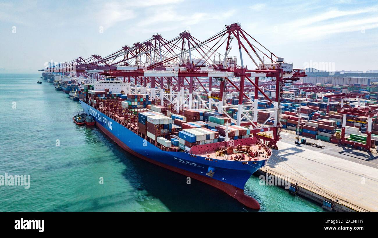 QINGDAO, CHINA - JUNE 18, 2024 - Container ships carry out container ...