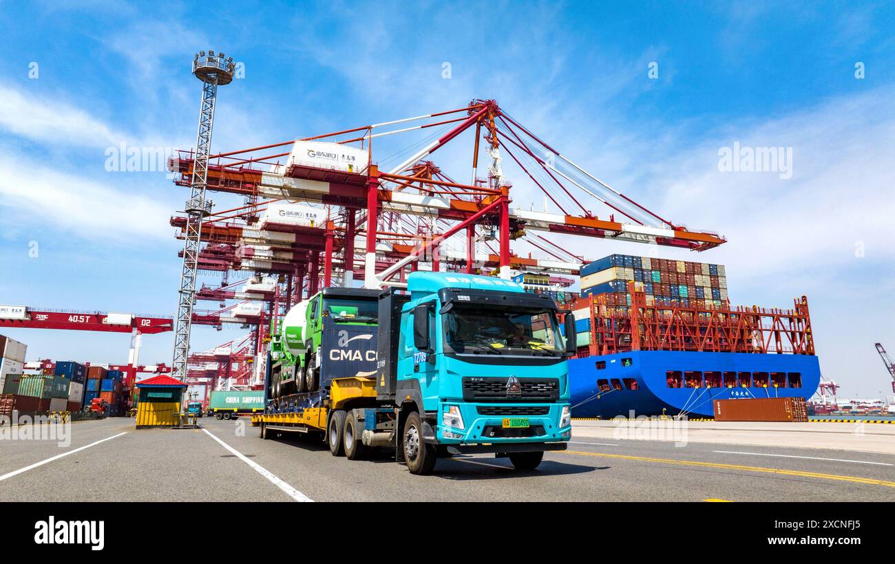 QINGDAO, CHINA - JUNE 18, 2024 - Container ships carry out container ...