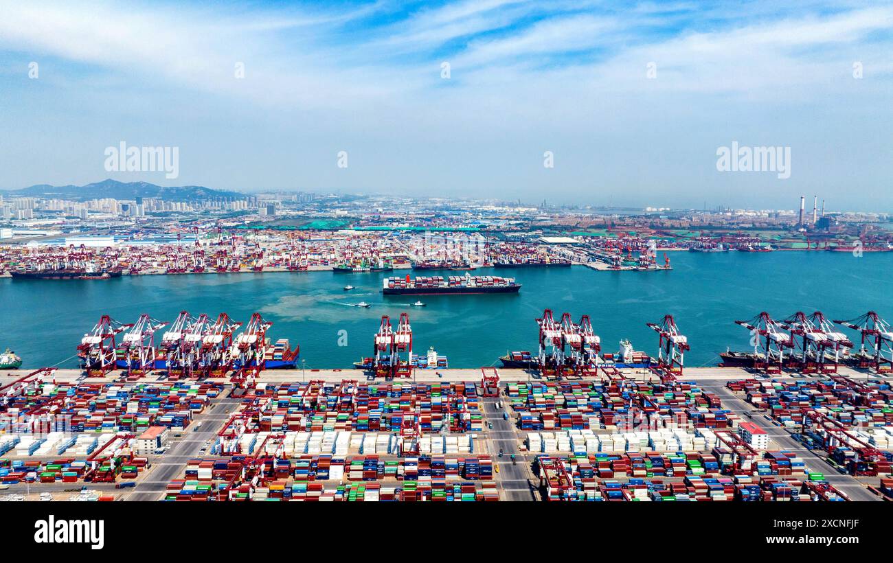 QINGDAO, CHINA - JUNE 18, 2024 - Container ships carry out container ...