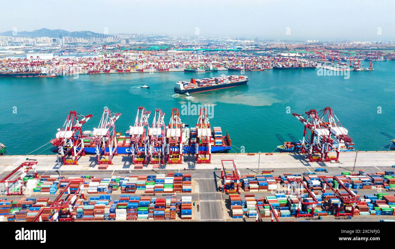 QINGDAO, CHINA - JUNE 18, 2024 - Container ships carry out container ...