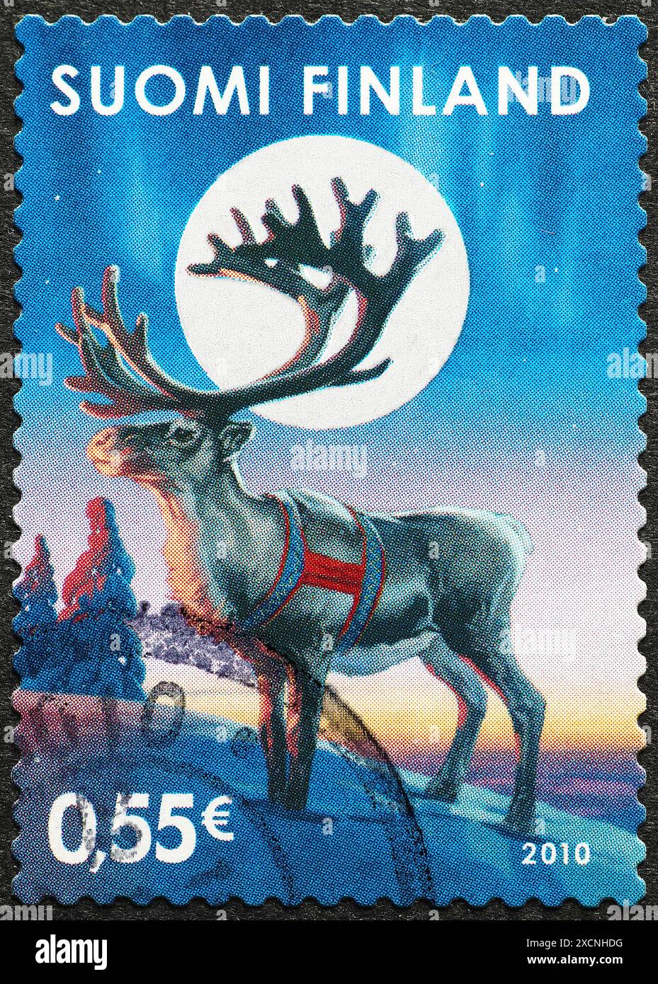 Christmas postage stamp with a reindeer fron Finland Stock Photo - Alamy