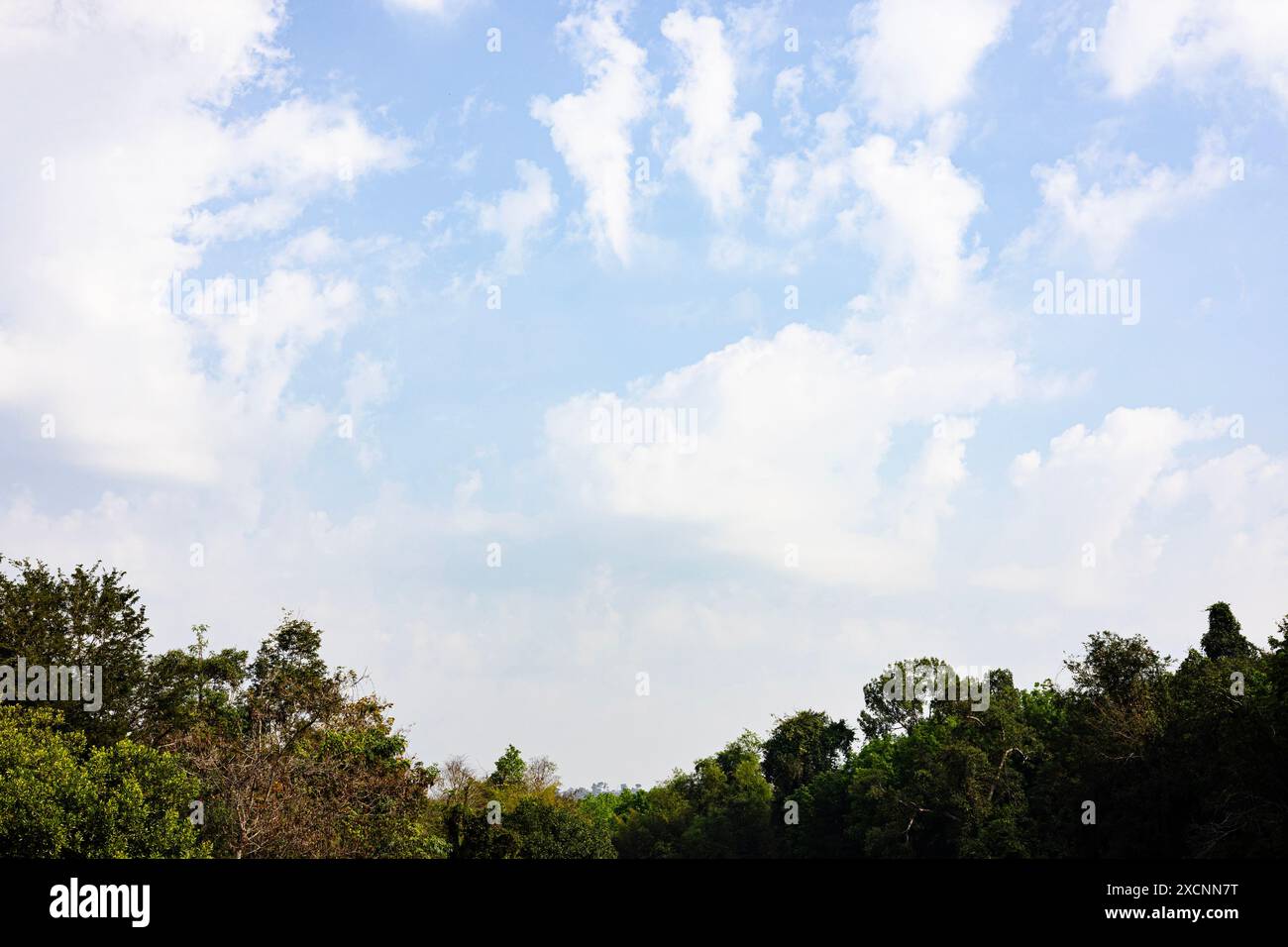 Pretty huge white clouds in the blue sky background Stock Photo - Alamy