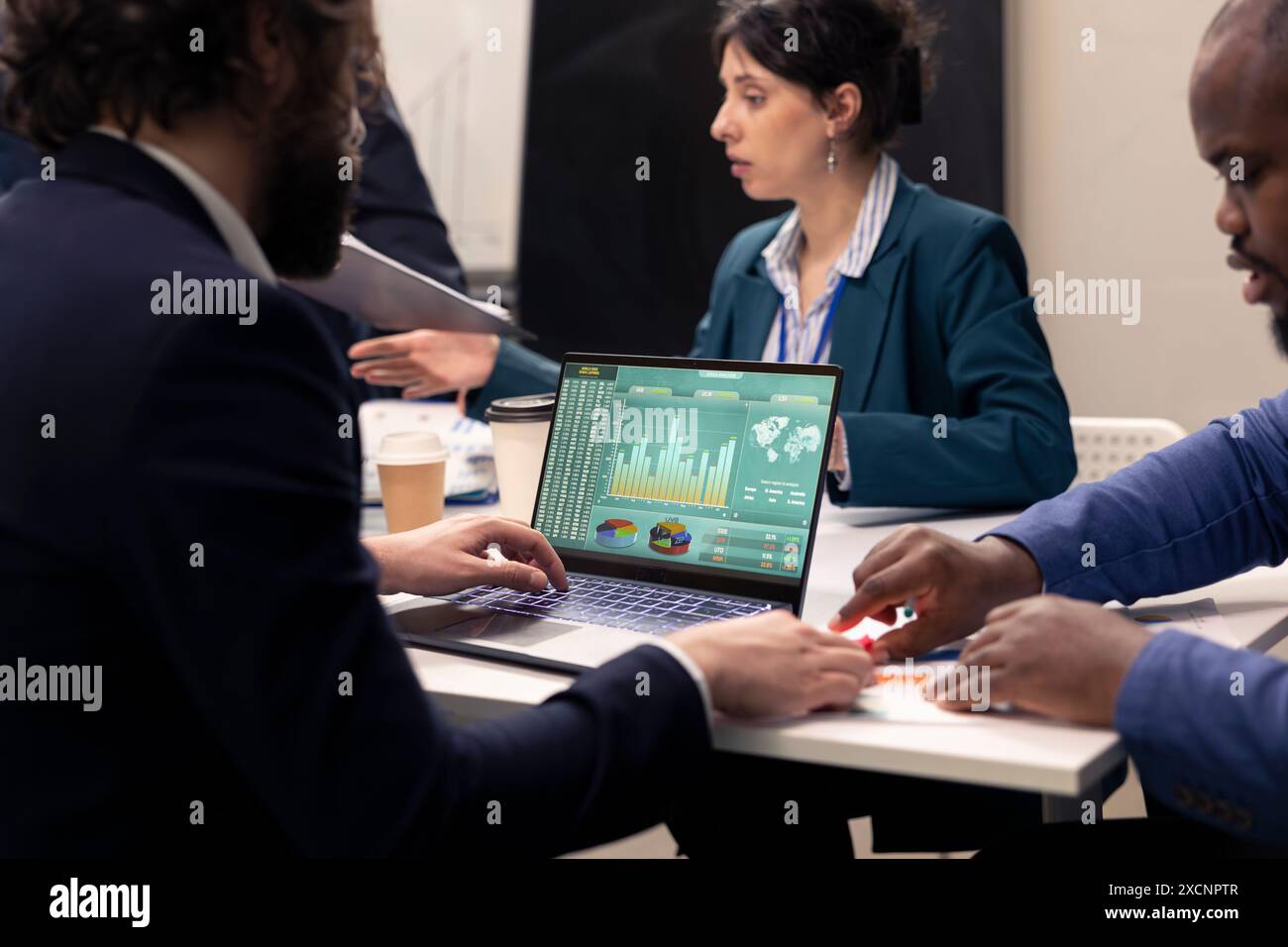 Marketing team developing new digital transformation strategies in a boardroom conference, enhance operational efficiency and performance. Professionals improve organizational workflow. Stock Photo