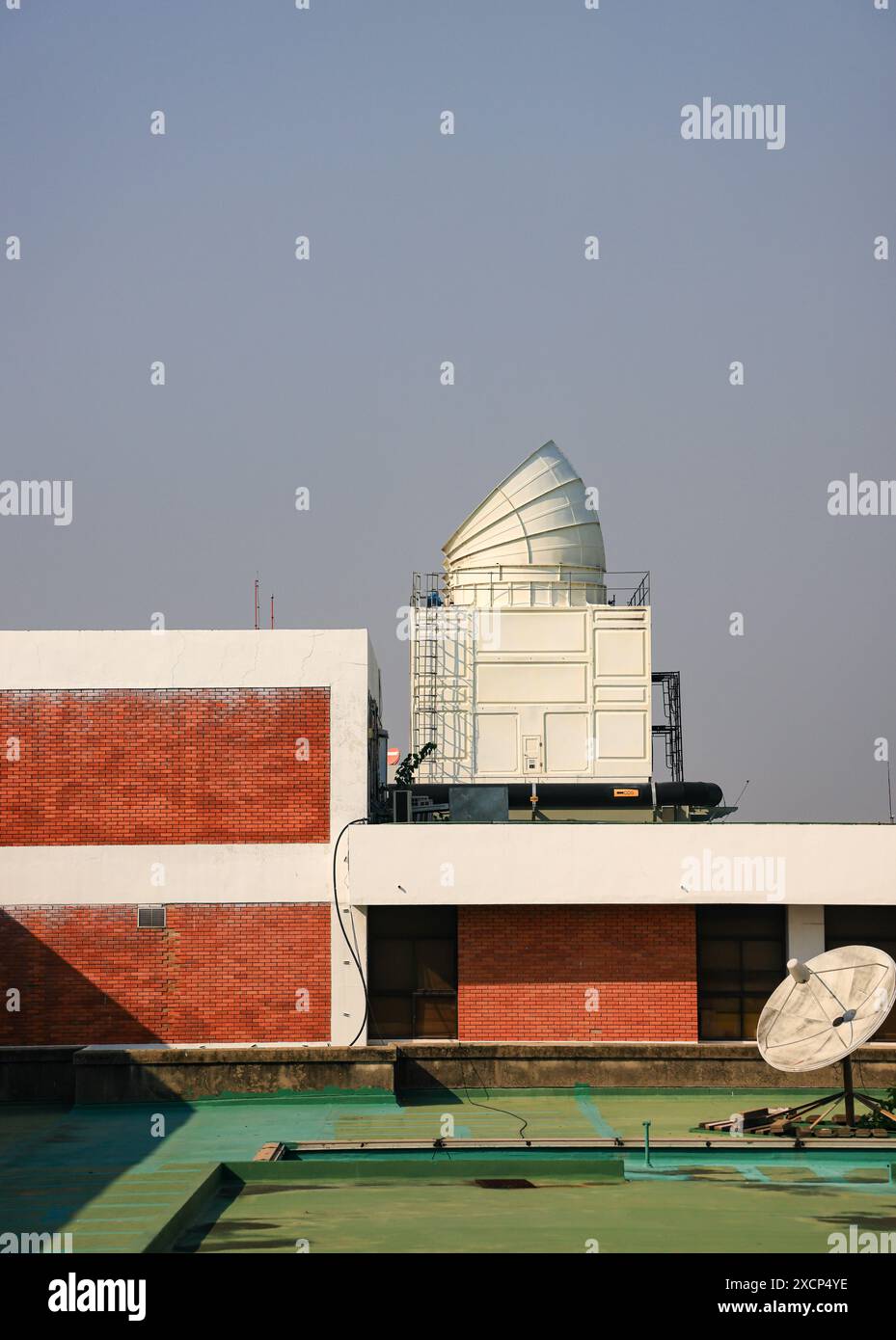 The air conditioning chiller mounted on the roof of the building. Stock Photo