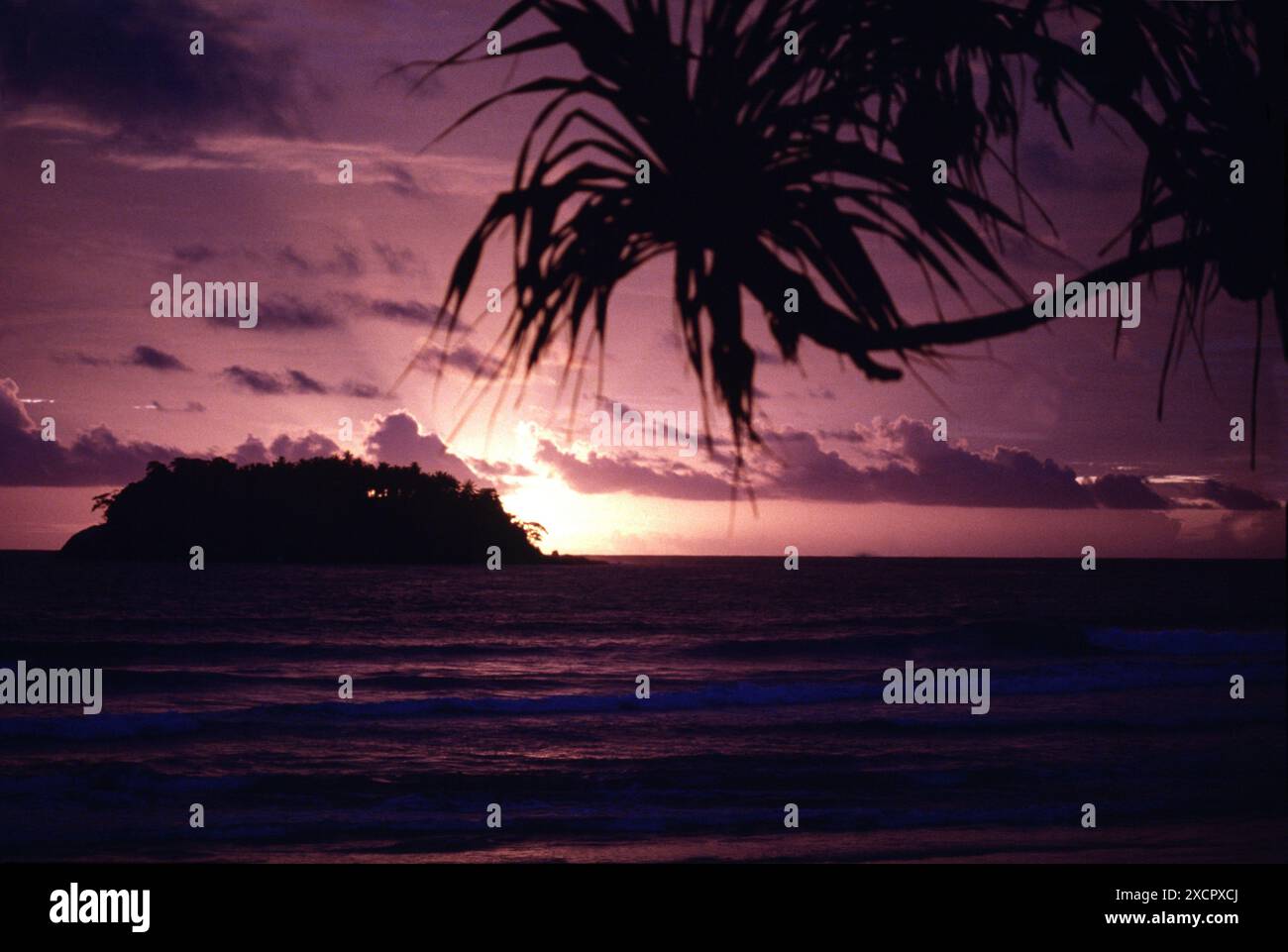 PPL PHOTO AGENCY - COPYRIGHT RESERVED  Island sunset, Nerleon, Thailand: The sunsetting behind a distant island. PHOTO CREDIT: Barry Pickthall/PPL Tel Stock Photo