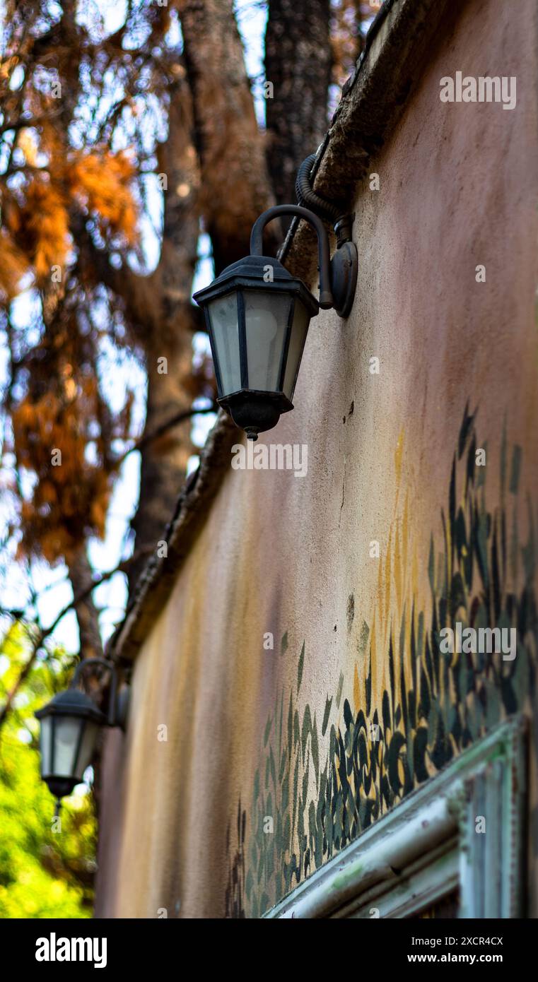Street lamp on a painted old wall. Stock Photo