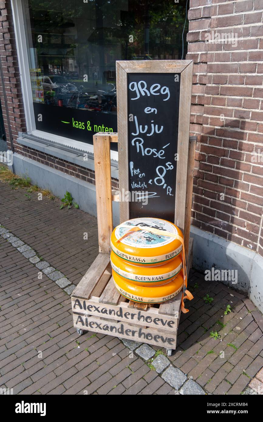 Weesp, The Netherlands. Traditional Dutch cheese on display outside a shop Stock Photo