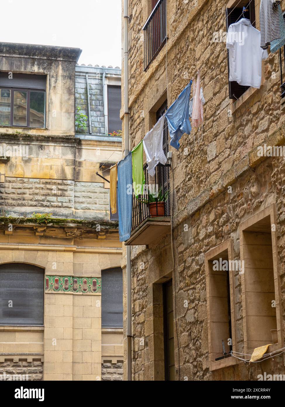 Photo from an old southern Spanish medieval town with laundry hanging out on a line. Stock Photo