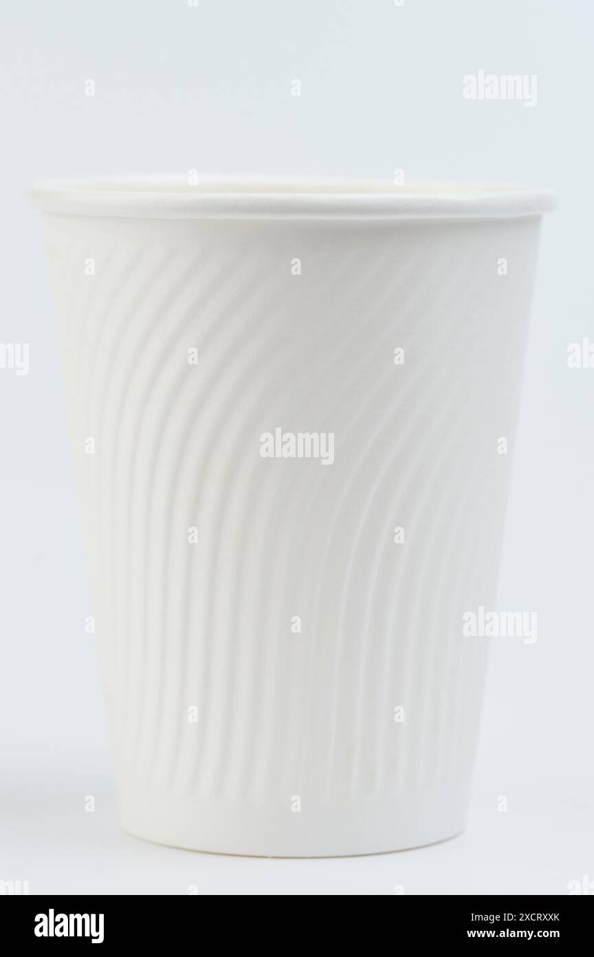 Clean white paper cup front view with grip isolated on white studio ...